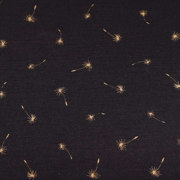 goldene Pusteblumen auf schwarz